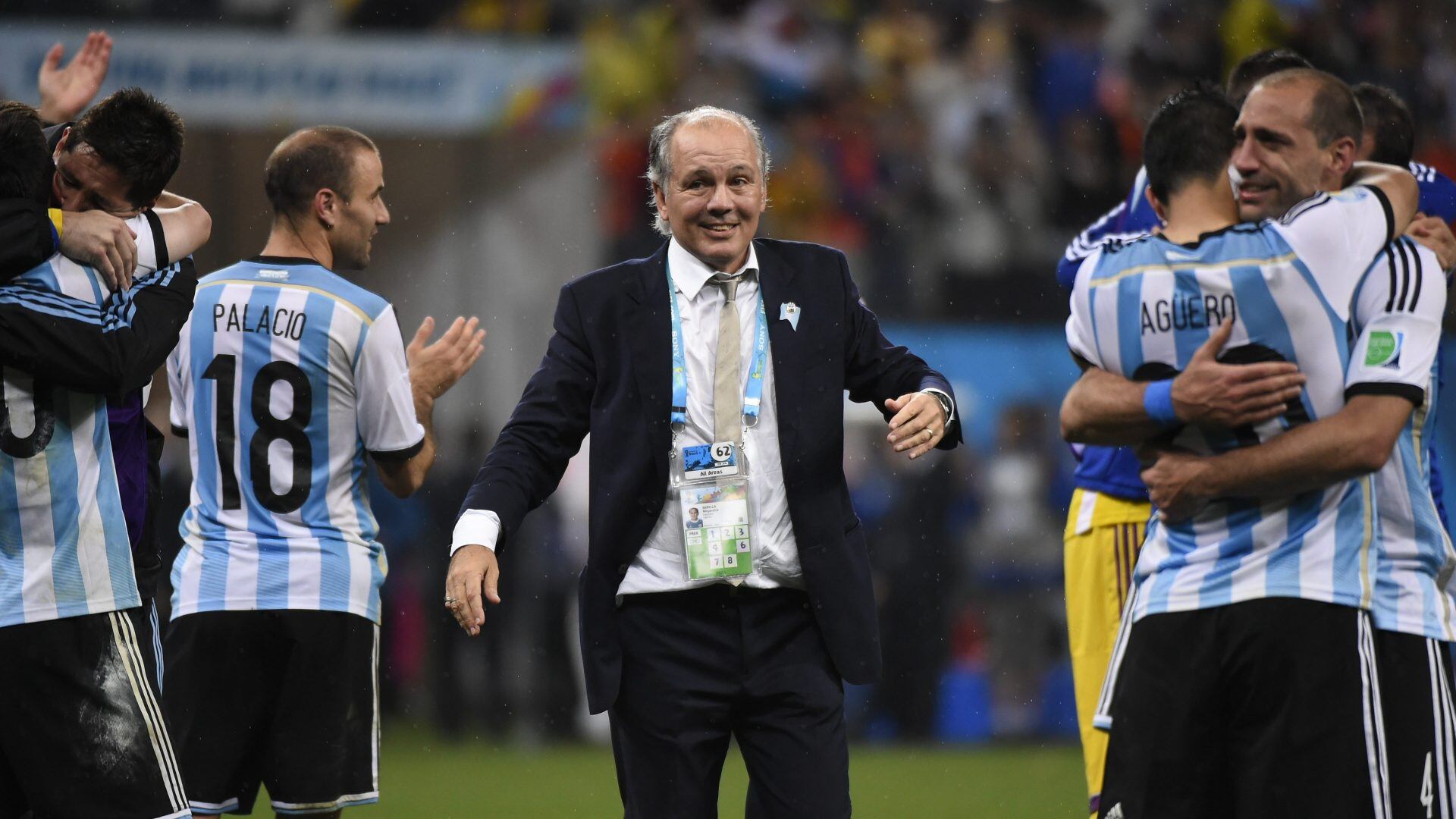 Argentina's coach Alejandro Sabella (C) celebrates with his team after winning their FIFA World Cup semi-final match against the Netherlands in a penalty shoot-out following extra time at The Corinthians Arena in Sao Paulo on July 9, 2014. AFP PHOTO / FABRICE COFFRINI        (Photo credit should read FABRICE COFFRINI/AFP via Getty Images)