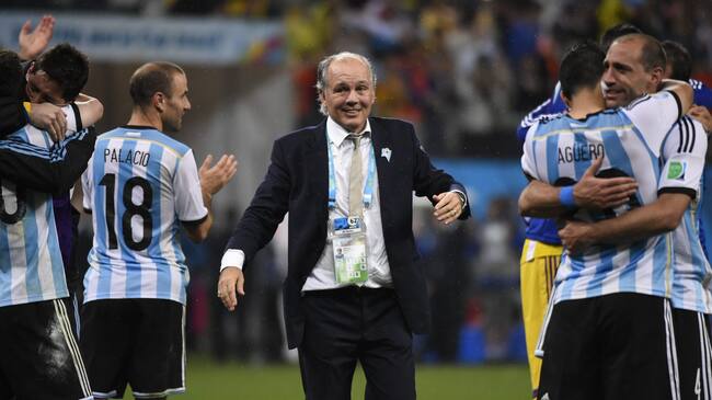 Argentina's coach Alejandro Sabella (C) celebrates with his team after winning their FIFA World Cup semi-final match against the Netherlands in a penalty shoot-out following extra time at The Corinthians Arena in Sao Paulo on July 9, 2014. AFP PHOTO / FABRICE COFFRINI (Photo credit should read FABRICE COFFRINI/AFP via Getty Images)