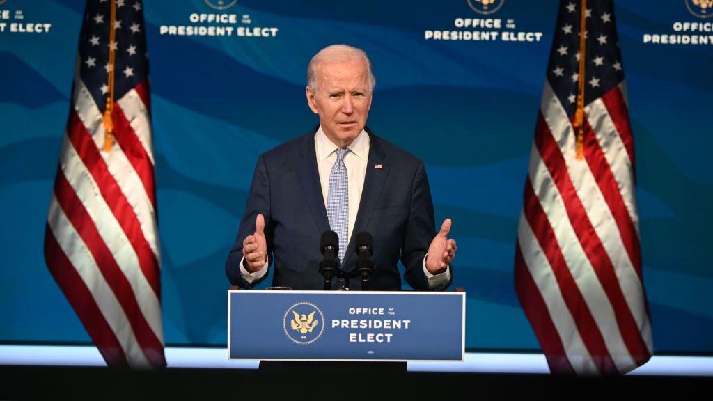 US President-elect Joe Biden speaks at the Queen Theater on January 6, 2021, in Wilmington, Delaware. - US Vice President Mike Pence, in defiance of President Donald Trump, said Wednesday that he will not intervene to stop the certification by Congress of Democrat Joe Biden's election victory. (Photo by JIM WATSON / AFP) (Photo by JIM WATSON/AFP via Getty Images)
