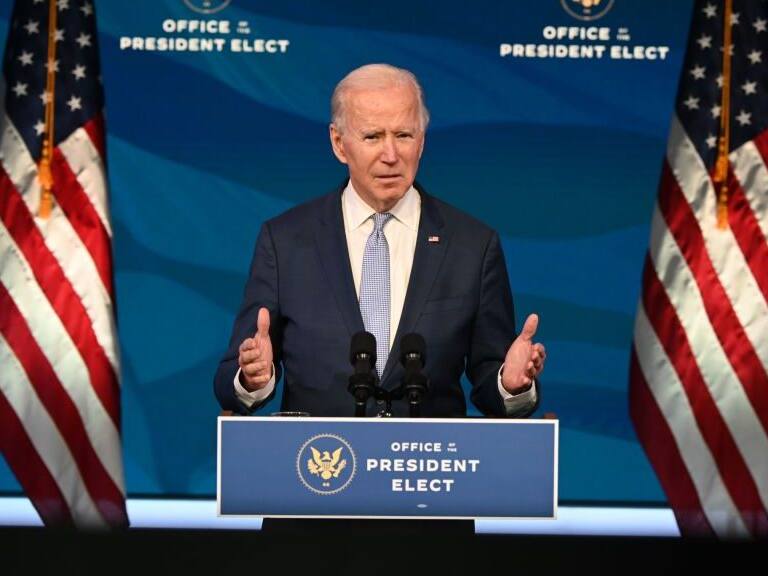US President-elect Joe Biden speaks at the Queen Theater on January 6, 2021, in Wilmington, Delaware. - US Vice President Mike Pence, in defiance of President Donald Trump, said Wednesday that he will not intervene to stop the certification by Congress of Democrat Joe Biden's election victory. (Photo by JIM WATSON / AFP) (Photo by JIM WATSON/AFP via Getty Images)