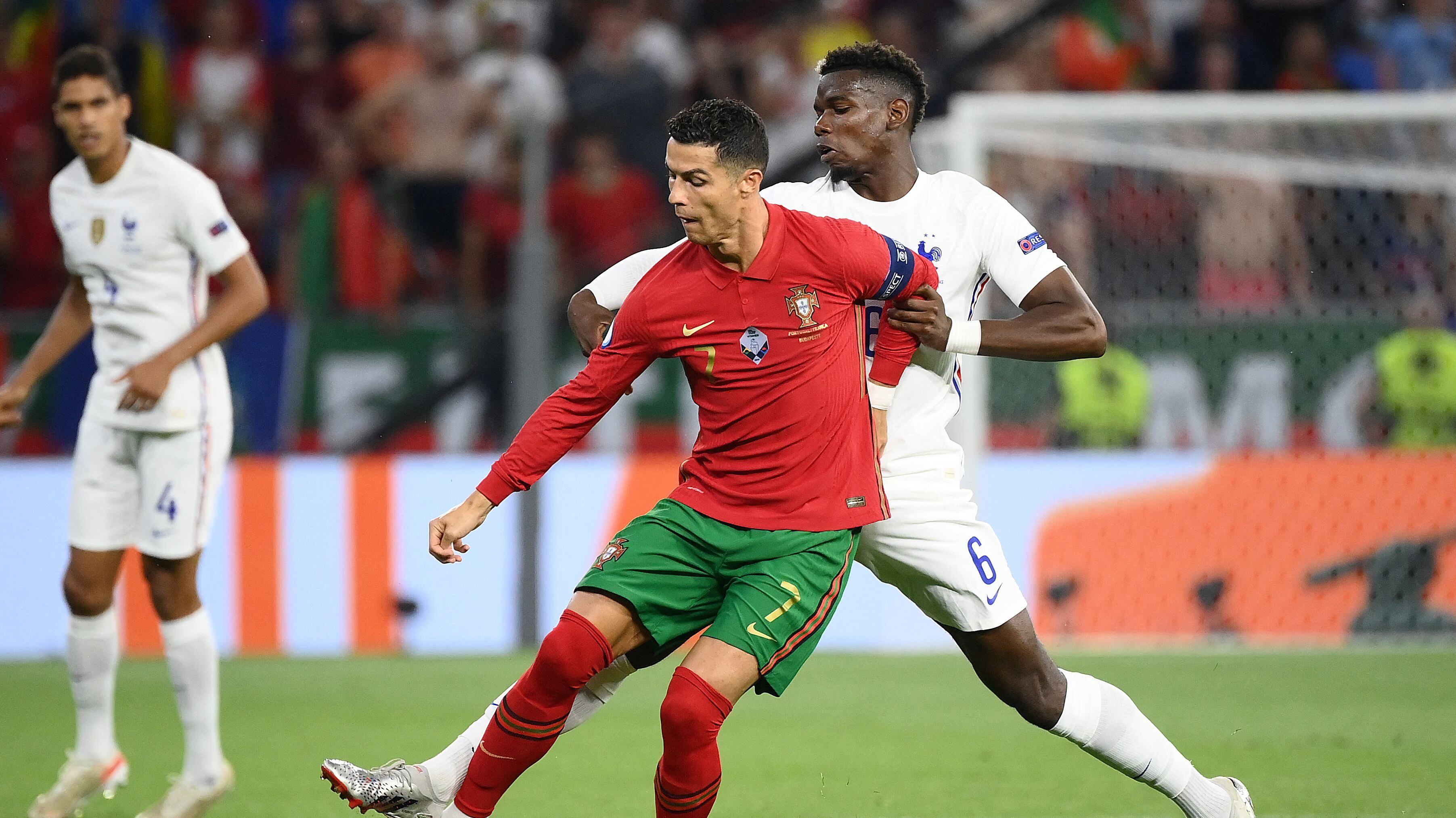 France's midfielder Paul Pogba (R) and Portugal's forward Cristiano Ronaldo vie for the ball during the UEFA EURO 2020 Group F football match between Portugal and France at Puskas Arena in Budapest on June 23, 2021. (Photo by FRANCK FIFE / POOL / AFP) (Photo by FRANCK FIFE/POOL/AFP via Getty Images)