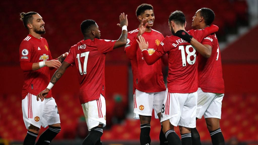 MANCHESTER, ENGLAND - DECEMBER 20: Bruno Fernandes of Manchester United celebrates with team mates (l - r) Alex Telles, Fred, Marcus Rashford and Anthony Martial after scoring their sides sixth goal during the Premier League match between Manchester United and Leeds United at Old Trafford on December 20, 2020 in Manchester, England. The match will be played without fans, behind closed doors as a Covid-19 precaution. (Photo by Clive Brunskill/Getty Images)