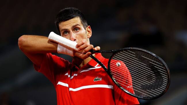 PARIS, FRANCE - OCTOBER 05: Novak Djokovic of Serbia reacts during his Men's Singles fourth round match against Karen Khachanov of Russia on day nine of the 2020 French Open at Roland Garros on October 05, 2020 in Paris, France. (Photo by Julian Finney/Getty Images)