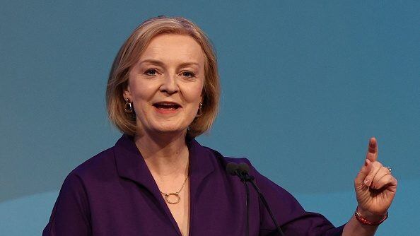 New Conservative Party leader and Britain's Prime Minister-elect Liz Truss gestures as she delivers a speech at an event to announce the winner of the Conservative Party leadership contest in central London on September 5, 2022. - Truss is the UK's third female prime minister following Theresa May and Margaret Thatcher. The 47-year-old has consistently enjoyed overwhelming support over 42-year-old Sunak in polling of the estimated 200,000 Tory members who were eligible to vote. (Photo by Adrian DENNIS / AFP) (Photo by ADRIAN DENNIS/AFP via Getty Images)