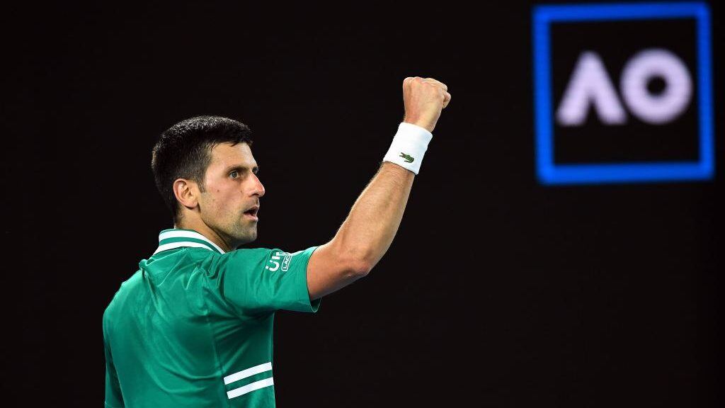 Serbia's Novak Djokovic celebrates a point against Germany's Alexander Zverev during their men's singles quarter-final match on day nine of the Australian Open tennis tournament in Melbourne on February 16, 2021. (Photo by William WEST / AFP) / -- IMAGE RESTRICTED TO EDITORIAL USE - STRICTLY NO COMMERCIAL USE -- (Photo by WILLIAM WEST/AFP via Getty Images)