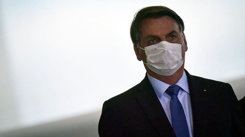 Brazil's President Jair Bolsonaro arrives at the Emergency Aid Extension ceremony at the Planalto Palace in Brasília, Brazil, on June 30, 2020.The Emergency Aid is a financial benefit granted by the Federal Government to workers and unemployed people affected by the Coronavirus (COVID-19) pandemic. (Photo by Andre Borges/NurPhoto via Getty Images)