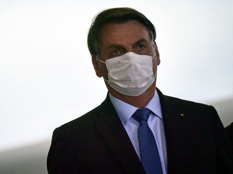 Brazil&#039;s President Jair Bolsonaro arrives at the Emergency Aid Extension ceremony at the Planalto Palace in Brasília, Brazil, on June 30, 2020.The Emergency Aid is a financial benefit granted by the Federal Government to workers and unemployed people affected by the Coronavirus (COVID-19) pandemic. (Photo by Andre Borges/NurPhoto via Getty Images)