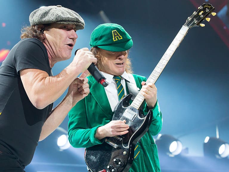 KANSAS CITY, MO - FEBRUARY 28:  Singer Brian Johnson (L) and musician Angus Young of AC/DC performs at Sprint Center on February 28, 2016 in Kansas City, Missouri.  (Photo by Jason Squires/WireImage)