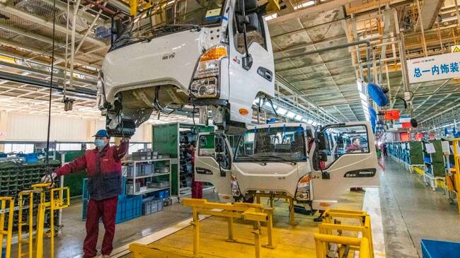 QINGZHOU, CHINA - NOVEMBER 30, 2020 - A worker lifts on a production line at the assembly plant of an automobile manufacturing company in Qingzhou City, East China's Shandong Province, Nov. 30, 2020. The manufacturing PMI has been above the tipping point for nine consecutive months.- PHOTOGRAPH BY Costfoto / Barcroft Studios / Future Publishing (Photo credit should read Costfoto/Barcroft Media via Getty Images)