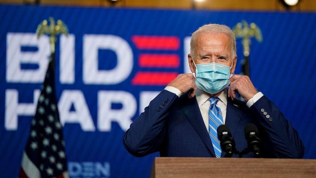 WILMINGTON, DE - NOVEMBER 04: Democratic presidential nominee Joe Biden takes his face mask off as he arrives to speak one day after Americans voted in the presidential election, on November 04, 2020 in Wilmington, Delaware. Biden spoke as votes are still being counted in his tight race against incumbent U.S. President Donald Trump which remains too close to call. (Photo by Drew Angerer/Getty Images)