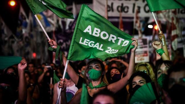 BUENOS AIRES, ARGENTINA - DECEMBER 30: Pro-choice demonstrators wait for the result of vote on December 30, 2020 in Buenos Aires, Argentina. The proposal authorizes legal, voluntary and free interruption of pregnancy until the 14th week while allowing doctor's conscientious objection. It is the ninth bill to legalize abortion treated by the Argentine Congress and the first one publicly supported by the president of the country. (Photo by Marcelo Endelli/Getty Images)