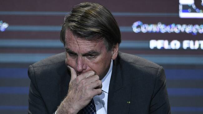 BRASILIA, BRAZIL - DECEMBER 07: President of Brazil Jair Bolsonaro gestures during a meeting with businessmen promoted by the National Confederation of Industry (CNI) on December 07, 2021 in Brasília, Brazil. (Photo by Mateus Bonomi/Getty Images)
