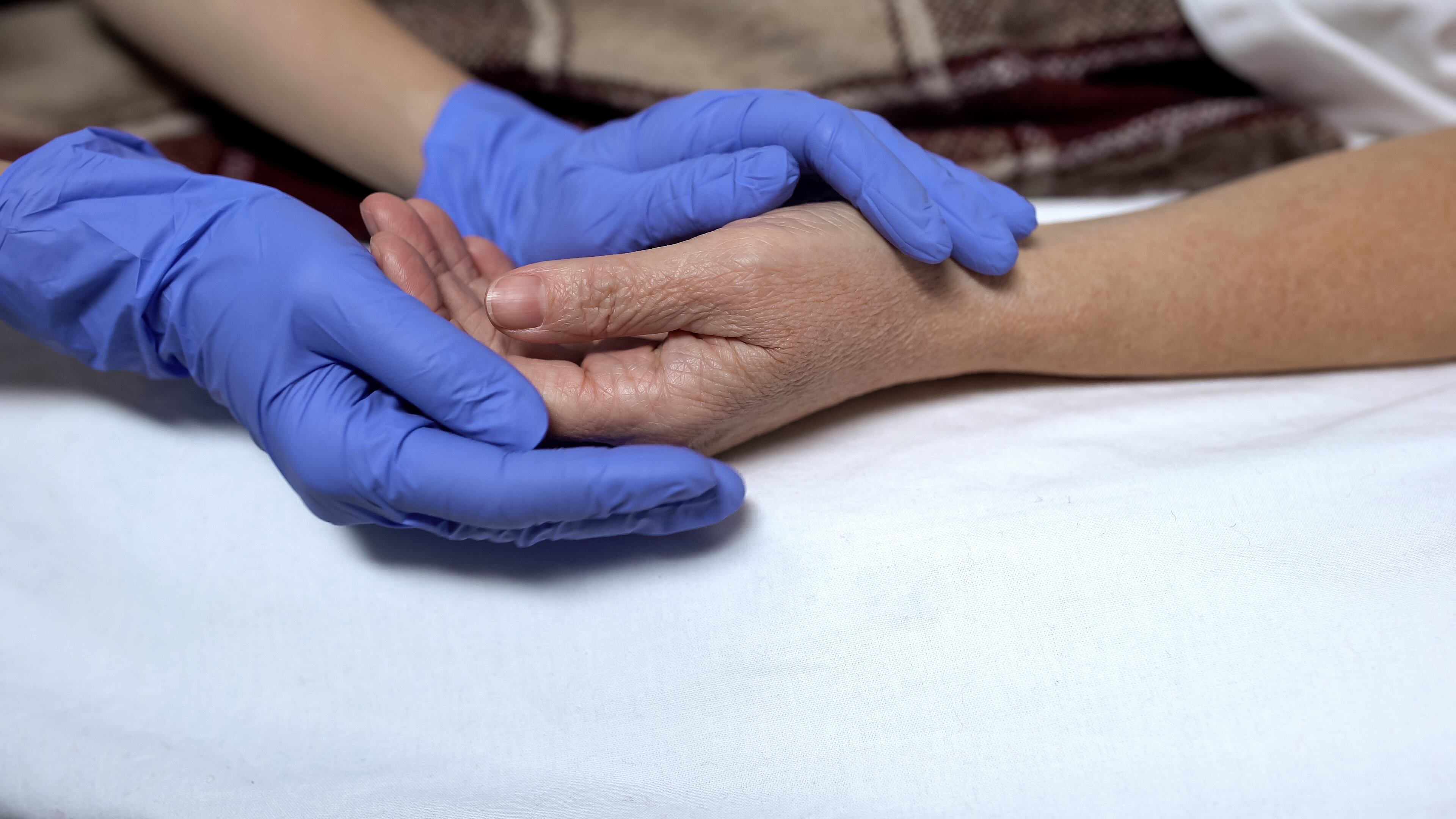 Nurse supporting and calming down patient before procedure caring hospital staff