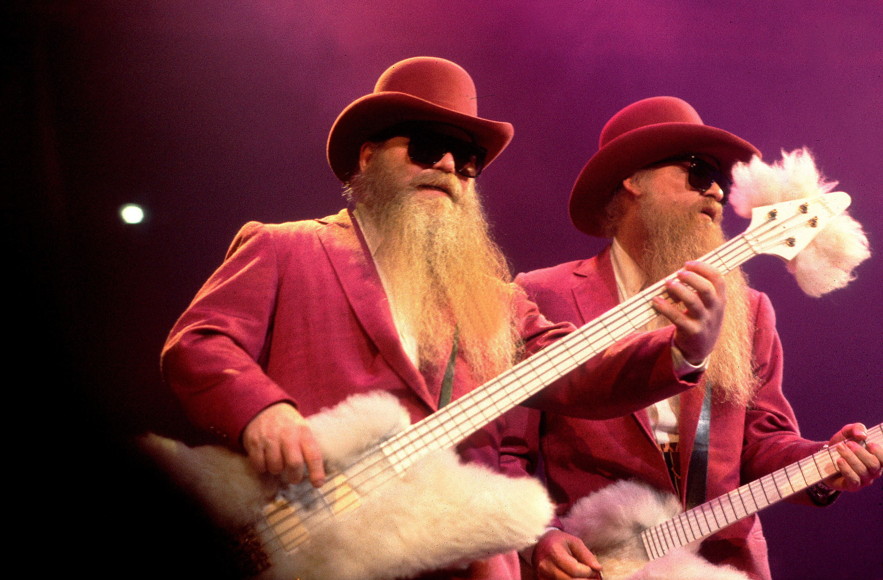 American Rock musicians Dusty Hill (left)and Billy Gibbons, both of the group ZZ Top, perform onstage at the Bradley Center, Milwaukee, Wisconsin, October 31, 1990. (Photo by Paul Natkin/Getty Images)