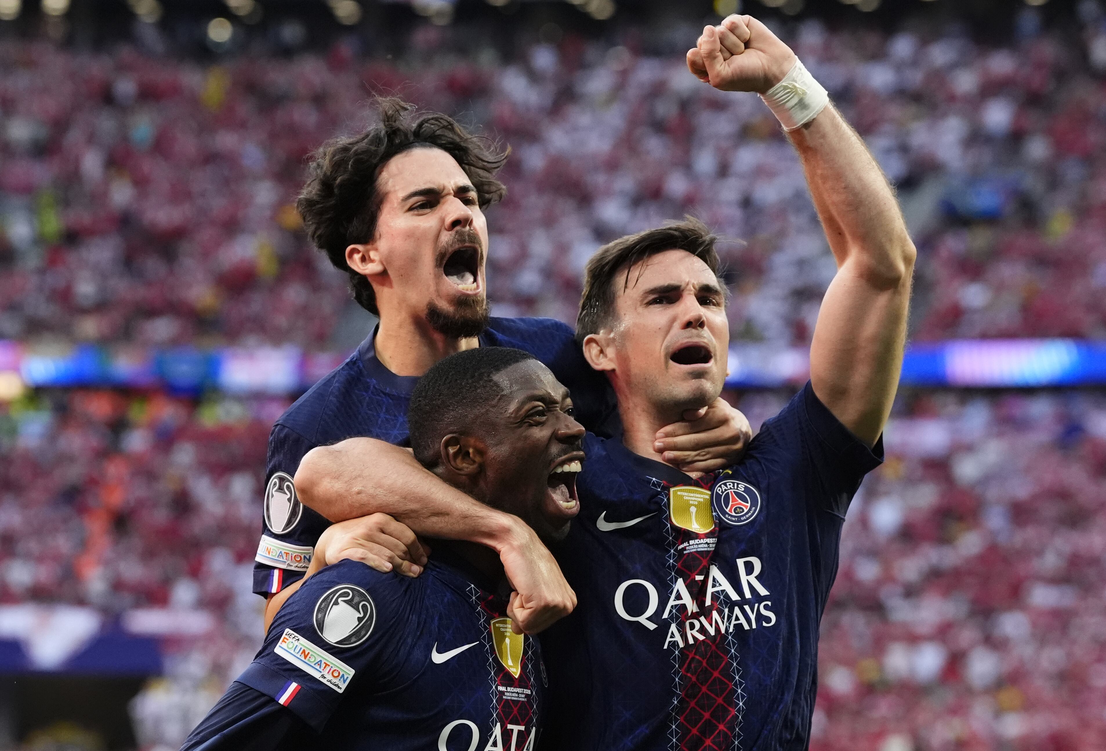 Paris Saint-Germain's Ousmane Dembele (centre) celebrates with team-mates Vitinha (left) and Fabian Ruiz after scoring their side's first goal of the game from the penalty spot during the UEFA Champions League Final at the Puskas Arena, Budapest. Picture date: Saturday May 30, 2026. (Photo by Nick Potts/PA Images via Getty Images)