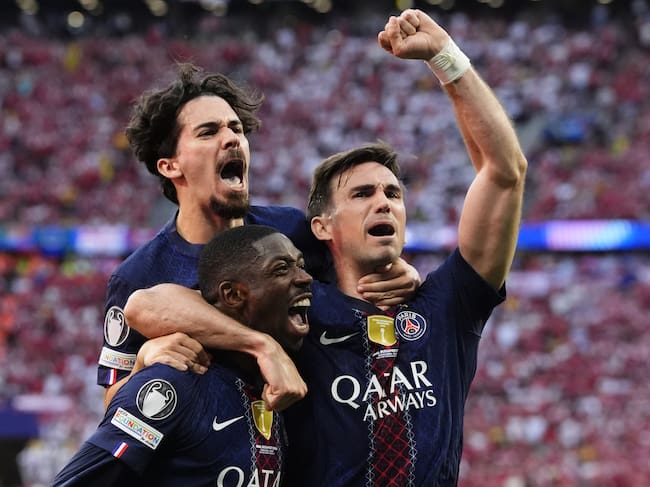 Paris Saint-Germain's Ousmane Dembele (centre) celebrates with team-mates Vitinha (left) and Fabian Ruiz after scoring their side's first goal of the game from the penalty spot during the UEFA Champions League Final at the Puskas Arena, Budapest. Picture date: Saturday May 30, 2026. (Photo by Nick Potts/PA Images via Getty Images)