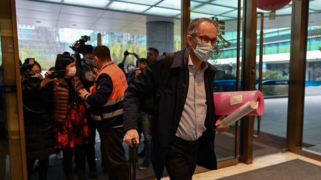 WHO team member Peter Ben Embarek (R) and other members of the group arrive at Tianhe International Airport to leave Wuhan in China's central Hubei province on February 10, 2021, after the World Health Organization (WHO) team wrapped up its investigation into the origins of the COVID-19 coronavirus. (Photo by Hector RETAMAL / AFP) (Photo by HECTOR RETAMAL/AFP via Getty Images)