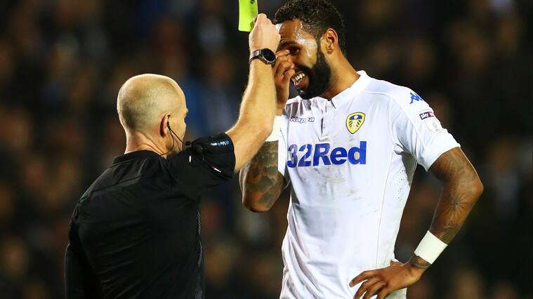 LEEDS, ENGLAND - OCTOBER 25: Kyle Bartley of Leeds United (R) is show a yellow card for handling the ball into the net during the EFL Cup fourth round match between Leeds United and Norwich City at Elland Road on October 25, 2016 in Leeds, England. (Photo by Matthew Lewis/Getty Images)