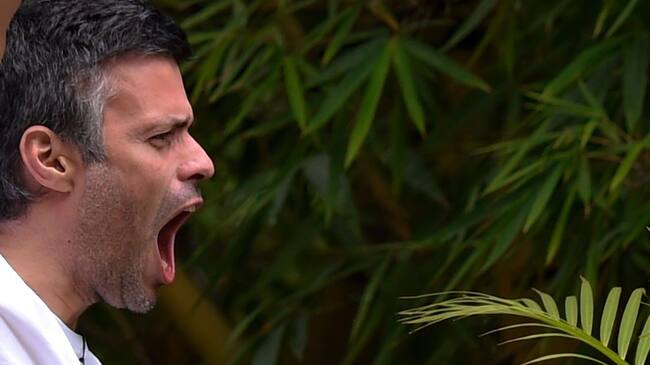 Venezuelan opposition leader Leopoldo Lopez shouts as he greets supporters gathering outside his house in Caracas, after he was released from prison and placed under house arrest for health reasons, on July 8, 2017.Venezuela's Supreme Court confirmed on its Twitter account it had ordered Lopez to be moved to house arrest, calling it a "humanitarian measure" granted on July 7 by the court's president Maikel Moreno. "Leopoldo Lopez is at his home in Caracas with (wife) Lilian and his children," Lopez's Spanish lawyer Javier Cremades said in Madrid. "He is not yet free but under house arrest. He was released at dawn." / AFP PHOTO / Juan BARRETO (Photo credit should read JUAN BARRETO/AFP via Getty Images)