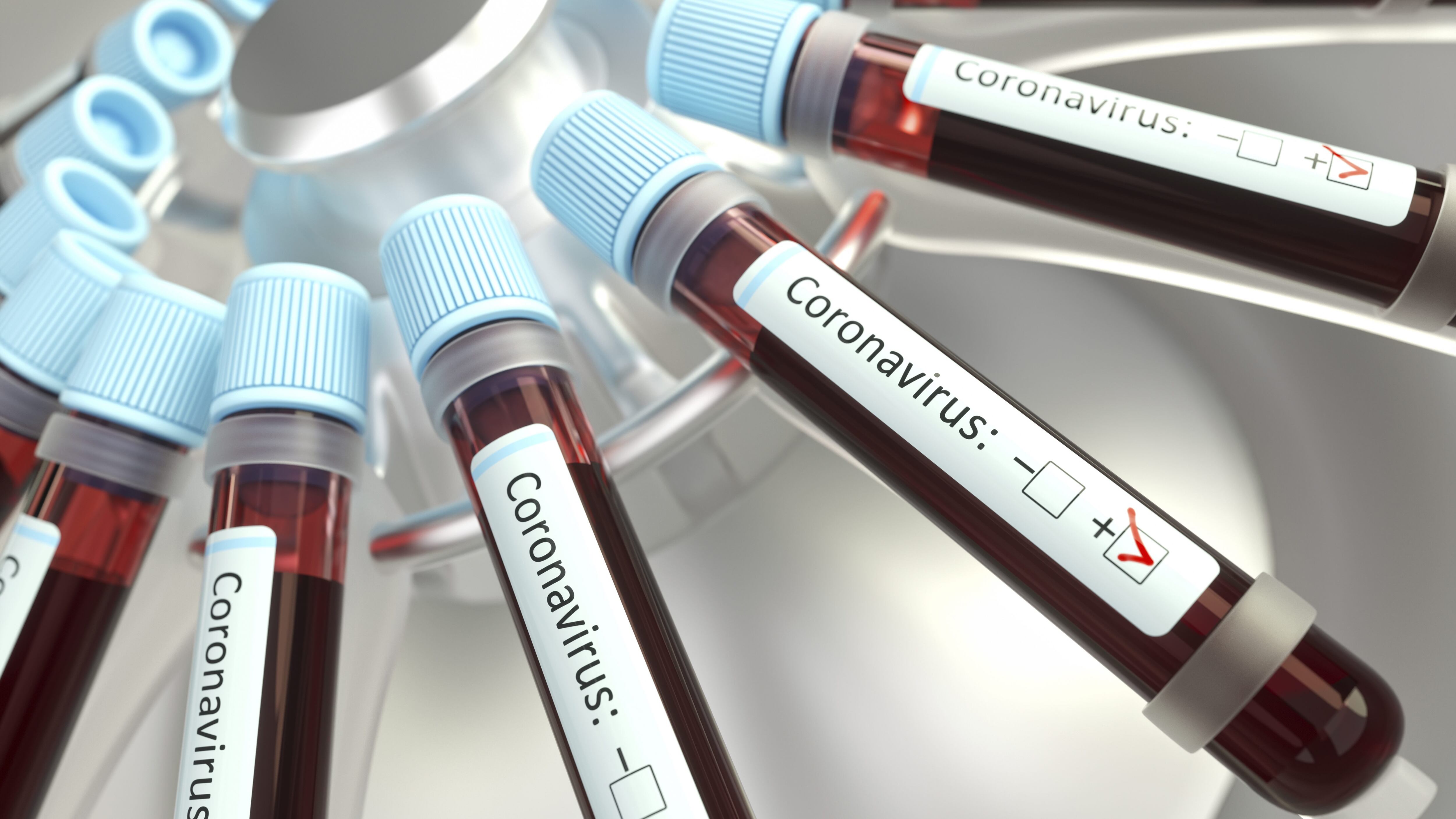 Coronaviruses research, conceptual illustration. Vials of blood in a centrifuge being tested for coronavirus infection.