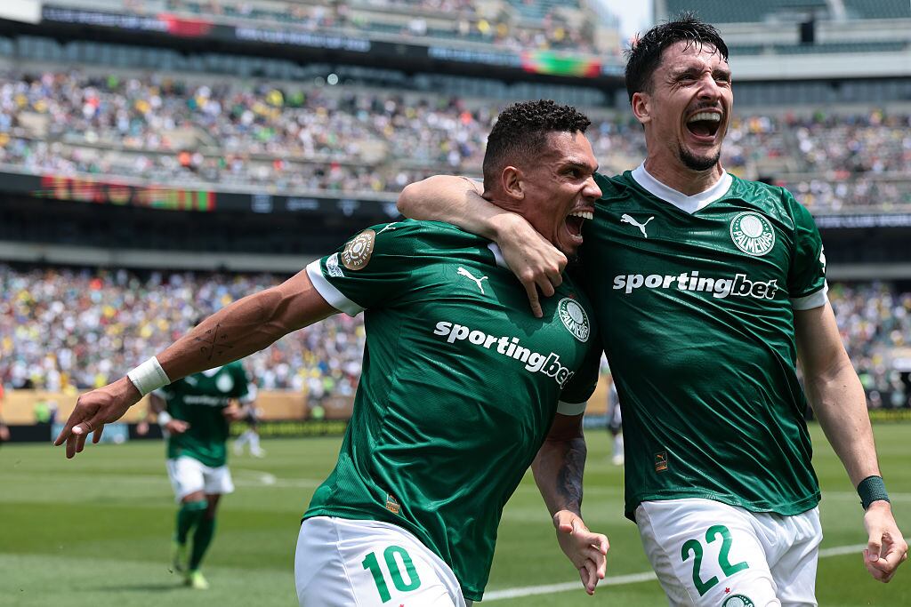 PHILADELPHIA, PENNSYLVANIA - JUNE 28: Paulinho of Palmeiras celebrates with teammate Joaquin Piquerez after scoring in extra time to give their side a 1-0 lead during the FIFA Club World Cup 2025 round of 16 match between SE Palmeiras and Botafogo FR at Lincoln Financial Field on June 28, 2025 in Philadelphia, Pennsylvania. (Photo by Jonathan Moscrop/Getty Images)