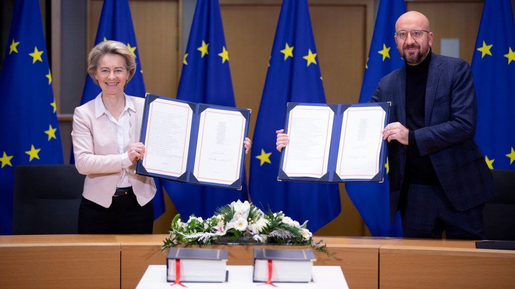 BRUSSELS, BELGIUM - DECEMBER 30: President of the European Commission Ursula von der Leyen (L) and the President of the European Council Charles Michel (R) attend a Brexit signature ceremony in the Europa building, the EU Council headquarters on December 30, 2020 in Brussels, Belgium. The United Kingdom and the European Union agreed a Trade and Cooperation Agreement, an Agreement on Nuclear Cooperation and an Agreement on Security Procedures for Exchanging and Protecting Classified Information on Christmas Eve 2020. These Agreements change the basis of the UK's relationship with the EU from EU law to free trade and friendly cooperation. In a referendum of 23 June 2016 the British people voted to take back control of their laws, borders, money, trade and fisheries, commonly referred to as Brexit. (Photo by Thierry Monasse/Getty Images)