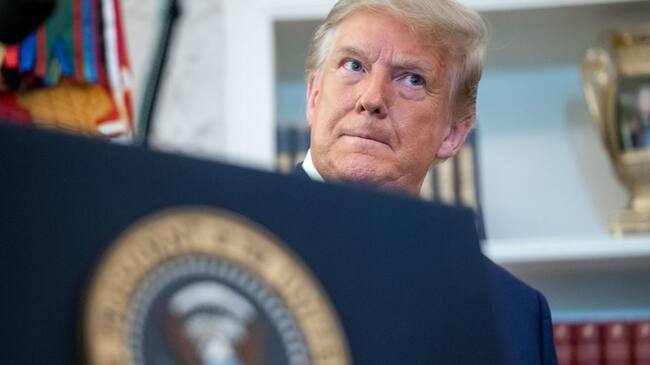 US President Donald Trump looks on during a ceremony presenting the Presidential Medal of Freedom to wrestler Dan Gable in the Oval Office of the White House in Washington, DC on December 7, 2020. (Photo by SAUL LOEB / AFP) (Photo by SAUL LOEB/AFP via Getty Images)