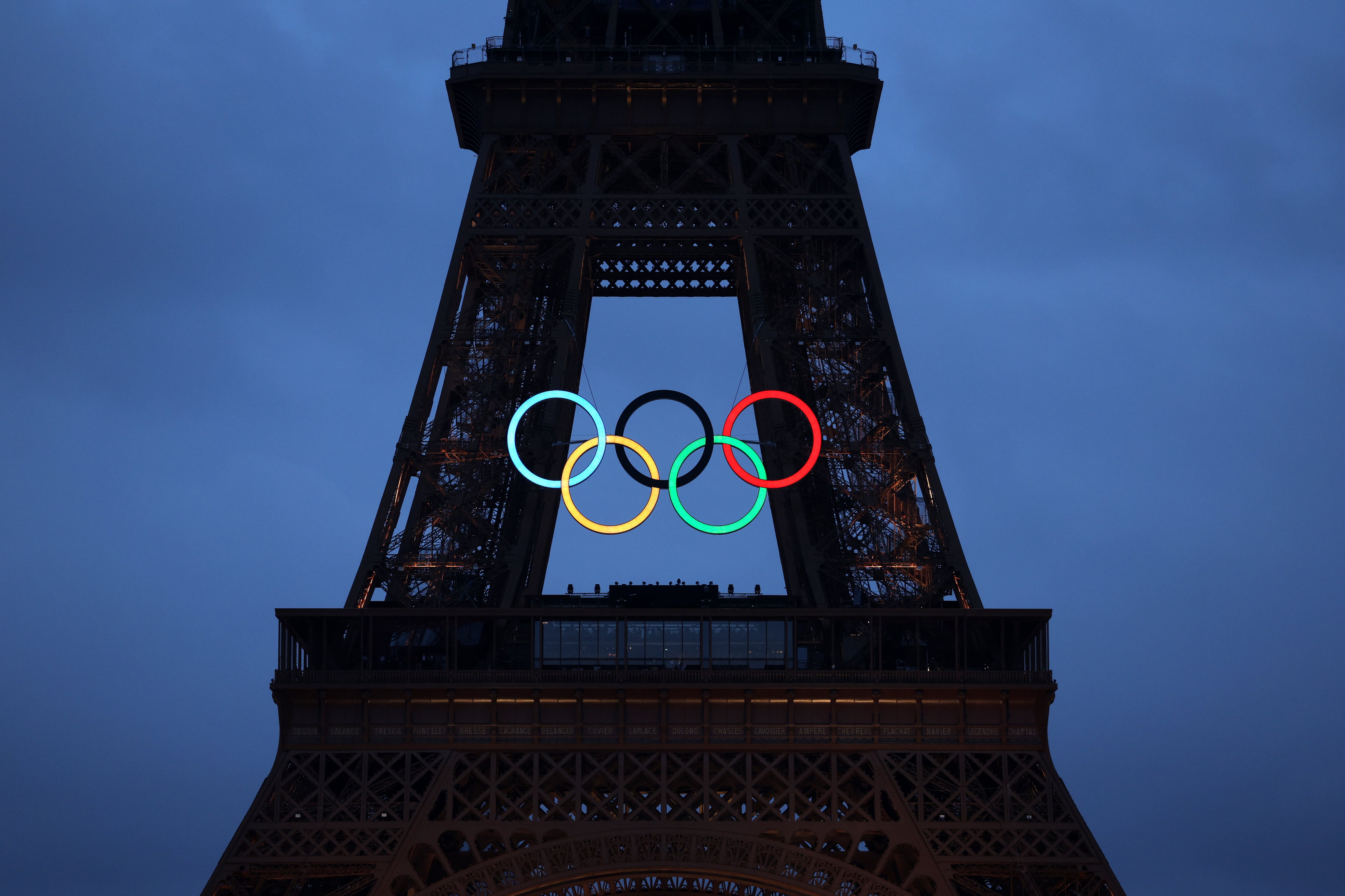 PARIS, FRANCE - JULY 26: The Olympic Rings illuminate on the Eiffel Tower during the opening ceremony of the Olympic Games Paris 2024 on July 26, 2024 in Paris, France. (Photo by Jamie Squire/Getty Images)