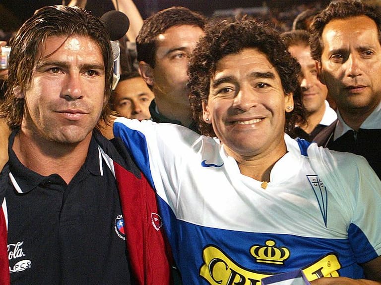 Santiago, CHILE:  Argentine football legend Diego Armando Maradona (R) poses with Chilean player Marcelo Salas (L) during a visit to Santiago, 01 March 2006. Maradona arrived in Santiago to play wtih the &quot;Universidad Catolica&quot; team in a friendly against the Chile national team.   AFP PHOTO/ CLAUDIO POZO  (Photo credit should read CLAUDIO POZO/AFP via Getty Images)