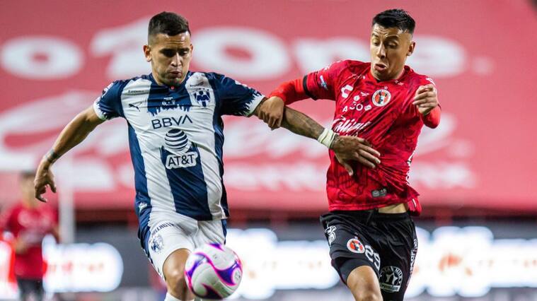 TIJUANA, MEXICO - OCTOBER 21: Sebastian Vegas of Monterrey fights for the ball with Edgar Lopez of Tijuana during the Final first leg match between Tijuana and Monterrey as part of the Copa MX 2020 at Caliente Stadium on October 21, 2020 in Tijuana, Mexico. (Photo by Carlos Heredia/Getty Images)