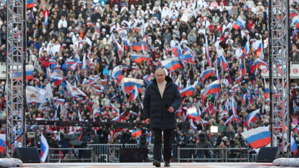 Russian President Vladimir Putin attends a concert marking the eighth anniversary of Russia's annexation of Crimea at the Luzhniki stadium in Moscow on March 18, 2022. (Photo by Mikhail KLIMENTYEV / SPUTNIK / AFP) (Photo by MIKHAIL KLIMENTYEV/SPUTNIK/AFP via Getty Images)