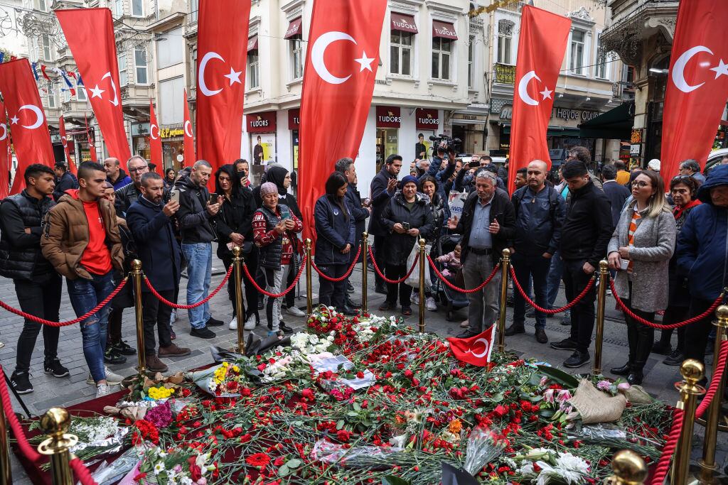 ISTANBUL, TURKIYE - NOVEMBER 15: Citizens pray and leave carnations to condemn after the deadly terror attack on Istiklal Avenue in Istanbul, Turkiye on November 15, 2022. The blast killed eight people and injured 81 others. (Photo by Muhammed Enes Yildirim/Anadolu Agency via Getty Images)