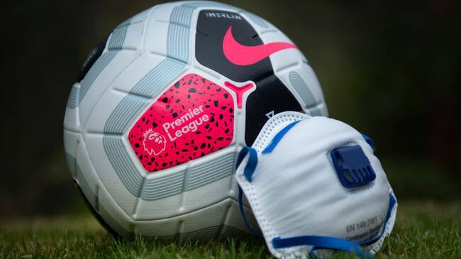 MANCHESTER, ENGLAND - APRIL 03: The official Nike Premier League match ball with a protective mask. The Coronavirus (COVID-19) pandemic has spread to many countries across the world, claiming over 40,000 lives and infecting hundreds of thousands more. on April 3, 2020 in Manchester, England (Photo by Visionhaus)