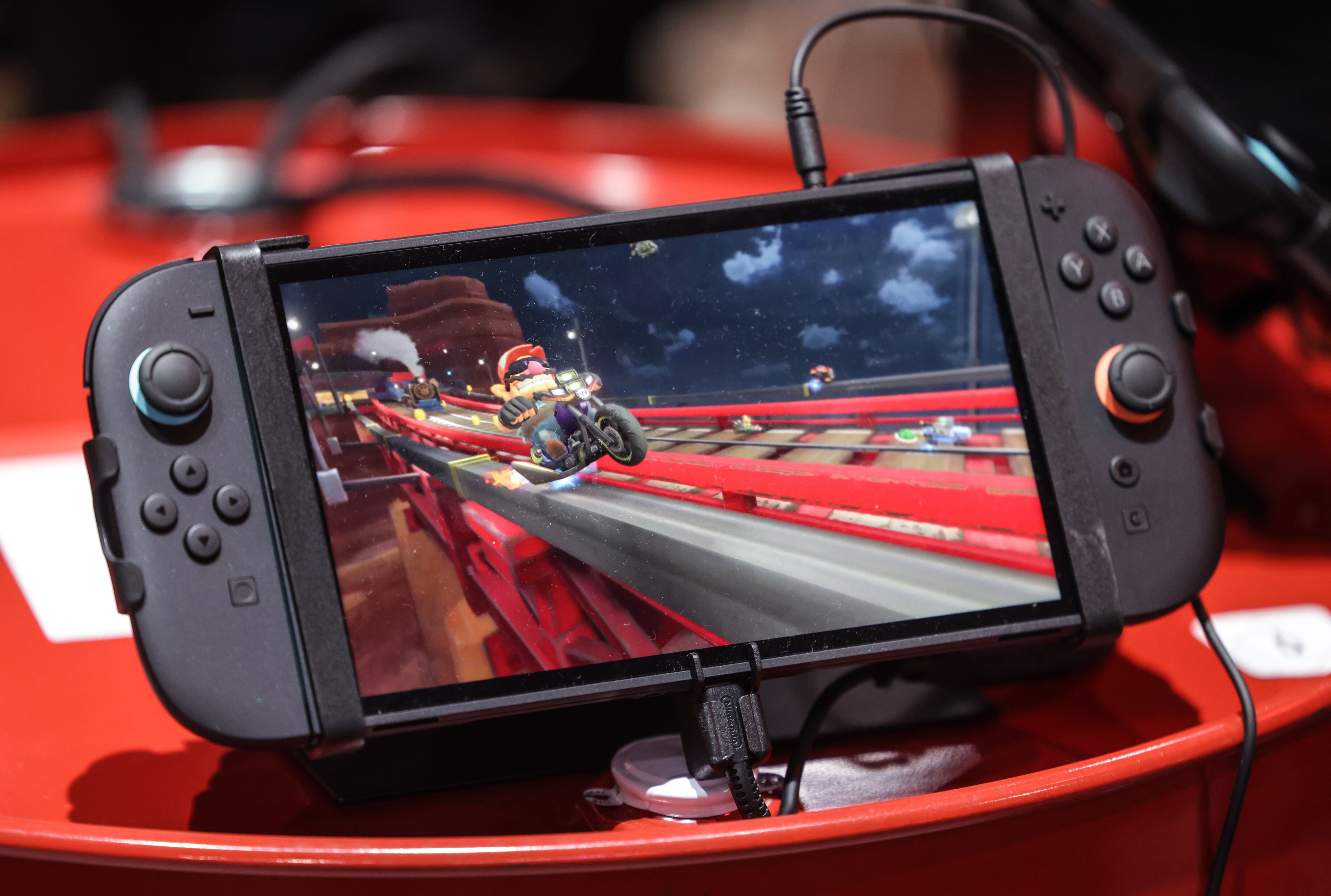 The new Nintendo Switch 2 handheld lies on a box. Photo: Oliver Berg/dpa (Photo by Oliver Berg/picture alliance via Getty Images)