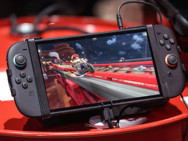 The new Nintendo Switch 2 handheld lies on a box. Photo: Oliver Berg/dpa (Photo by Oliver Berg/picture alliance via Getty Images)