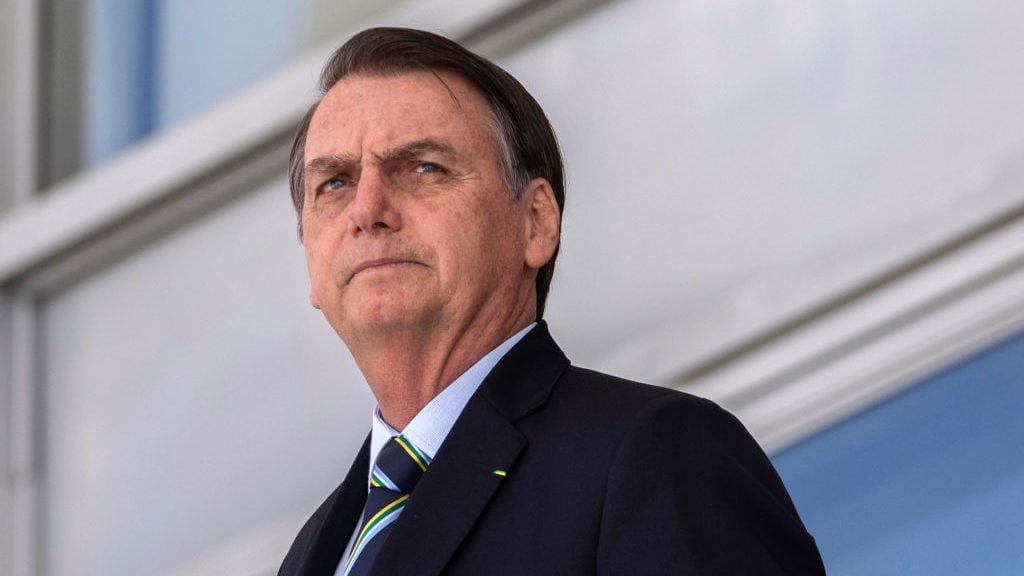Brazil's President Jair Bolsonaro, welcomes Paraguay's President Mario Abdo Benitez (out of frame) at Planalto palace in Brasilia on March 12, 2019. (Photo by Sergio LIMA / AFP)        (Photo credit should read SERGIO LIMA/AFP via Getty Images)