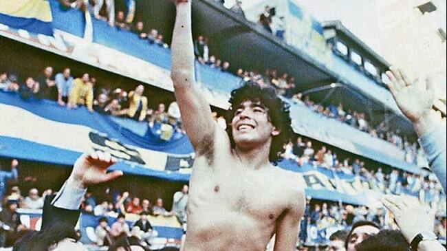 (FILE) This 1981 picture shoes Argentine soccer star Diego Armando Maradona, being carried by fans after winning the 1981 local Championship with Boca Juniors at La Bombonera stadium in Buenos Aires. Boca Juniors, the most popular football club in Argentina, celebrates on April 3rd, 2005, its centenary - from its creation by a group of football enthusiast in a humble neighbourhood of immigrants, until reaching the world's summit, and counting among its supporters with the most famous fan, Diego Armando Maradona. AFP PHOTO/DIARIO POPULAR/NA ARGENTINA OUT (Photo by DIARIO POPULAR / NA / AFP) (Photo credit should read DIARIO POPULAR/AFP via Getty Images)