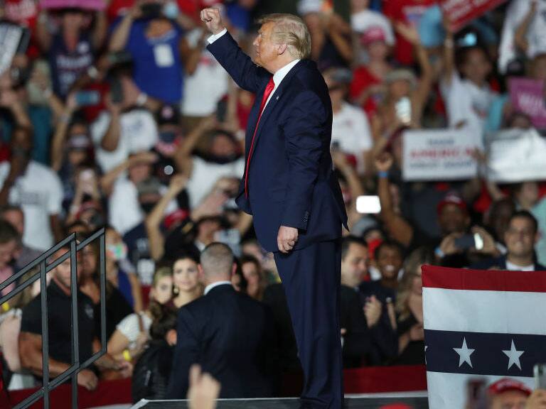 SANFORD, FLORIDA - OCTOBER 12: President Donald Trump waves to the crowd as he leaves after speaking during campaign event at the Orlando Sanford International Airport on October 12, 2020 in Sanford, Florida. Trump was holding his first campaign rally since his coronavirus diagnosis as he continues to campaign against Democratic presidential candidate Joe Biden. (Photo by Joe Raedle/Getty Images)