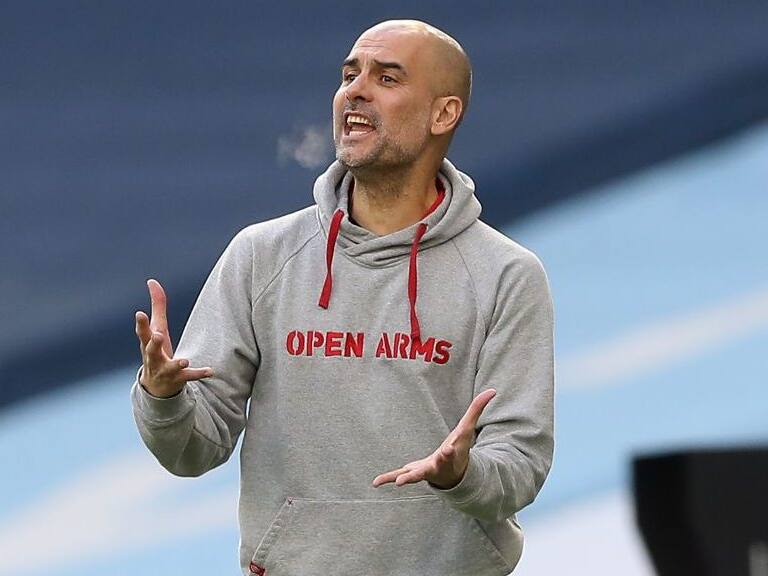 Manchester City's Spanish manager Pep Guardiola shouts instructions to his players from the touchline during the English Premier League football match between Manchester City and West Ham United at the Etihad Stadium in Manchester, north west England, on February 27, 2021. (Photo by Martin Rickett / POOL / AFP) / RESTRICTED TO EDITORIAL USE. No use with unauthorized audio, video, data, fixture lists, club/league logos or 'live' services. Online in-match use limited to 120 images. An additional 40 images may be used in extra time. No video emulation. Social media in-match use limited to 120 images. An additional 40 images may be used in extra time. No use in betting publications, games or single club/league/player publications. / (Photo by MARTIN RICKETT/POOL/AFP via Getty Images)