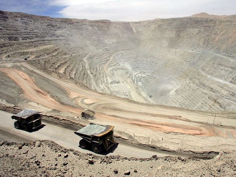 (FILE) A couple of gigantic Komatsu 930, 330 metric tons lorries arrive with their load at the Chuquicamata copper mine, in the desert town of Calama, 1000 km north of Santiago, Chile, 25 October, 2005. Chilean state mining firm Codelco saidon January 2, 2012 it was exercising its option to buy a 49 percent stake in a copper mining venture held by Anglo American in the latest twist of a long legal battle.   AFP PHOTO MARTIN BERNETTI (Photo credit should read MARTIN BERNETTI/AFP via Getty Images)