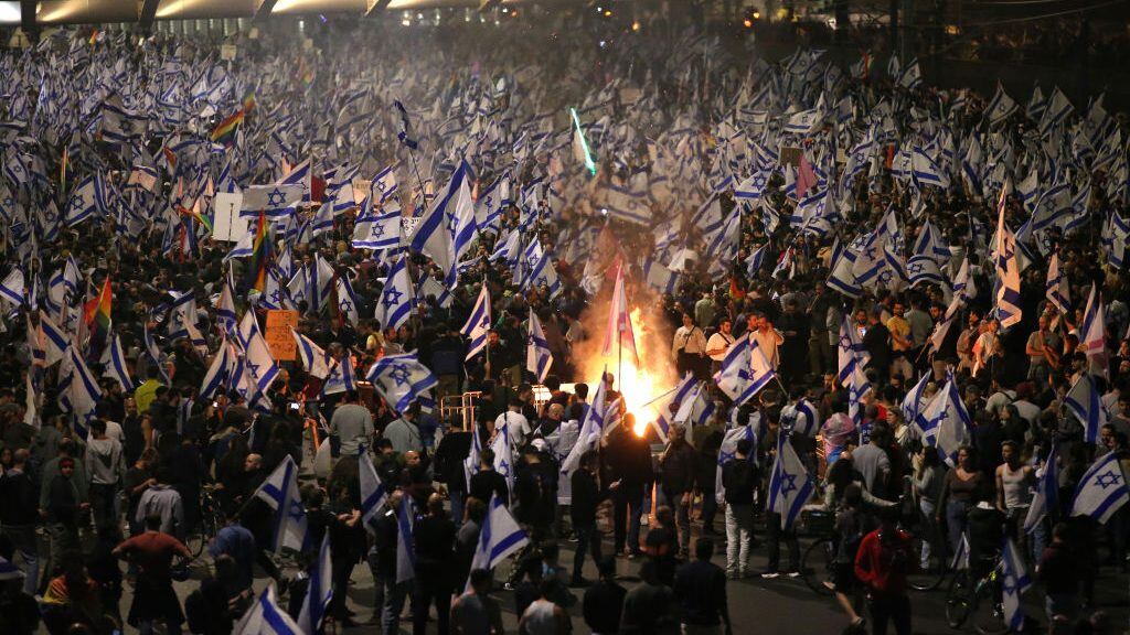 TEL AVIV, ISRAEL - MARCH 27: Thousands of Israelis take the streets as they block Ayalon highway in response to Prime Minister Benjamin Netanyahuâs surprise sacking of his defense minister Yoav Gallant in Tel Aviv, Israel on March 27, 2023. (Photo by Mostafa Alkharouf/Anadolu Agency via Getty Images)
