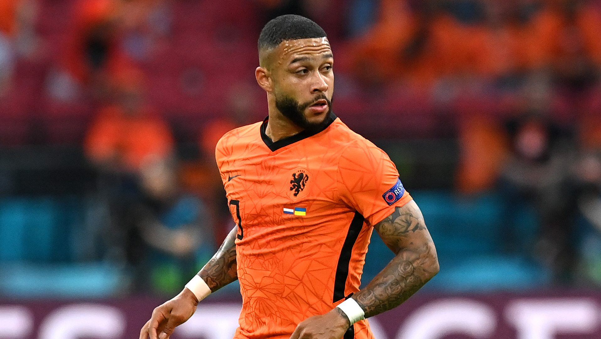 AMSTERDAM, NETHERLANDS - JUNE 13: Memphis Depay of Netherlands runs with the ball during the UEFA Euro 2020 Championship Group C match between Netherlands and Ukraine at the Johan Cruijff ArenA on June 13, 2021 in Amsterdam, Netherlands. (Photo by John Thys - Pool/Getty Images)