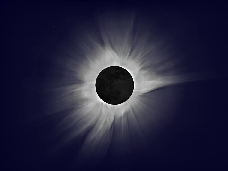 This is a photo of the March 9, 2016 total solar eclipse that I took on the path of totality from the small costal village of Pulau Dua on the East coast of Sulawesi Island, Indonesia.-
During the brief moment of "totality" (that lasted about 2 min), the Sun is completely hidden by the Moon, day becomes night (you can see stars), and you can then look directly at the total eclipse with the naked eyes, with no need for glasses or filters. And this is what you see!
-
The whitish hair-like structure around the Sun is called the "Corona", and can only be seen and photographed during the moment of totality, when the Sun is completely hidden by the Moon.
-
The Corona is formed by hot ionized gas particles (plasma) ejected by the Sun into space (eventually forming the "solar wind"). When they reach the Earth, those particles form aurora borealis ("northern lights"). The Corona continuously changes shape (very slowly) and it looks different for each total eclipse. The bright spot on the left is a prominence, i.e. giant splashes of sun's molten material.
-
I obtained this image using HDR processing, from just 3 exposures that I took with a regular DSLR camera and a 300mm telephoto, on a tripod. No filter was used since this photo was taken during the moment of "totality", when it is safe to look at the sun directly with the naked eyes.