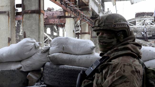 A serviceman of Ukrainian Military Forces stands guard at the destroyed industrial zone in town of Avdiivka on the front-line with Russia-backed separatists, on February 9, 2022. - The hope of avoiding a war in Ukraine grew on February 9, 2022 after the intense diplomatic activity of the last few days, which offers "real chances" of de-escalation according to Kiev, the Kremlin as well as the West noting first positive signals (Photo by Will VASSILOPOULOS / AFP) (Photo by WILL VASSILOPOULOS/AFP via Getty Images)