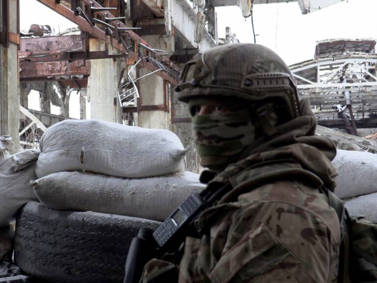 A serviceman of Ukrainian Military Forces stands guard at the destroyed industrial zone in town of Avdiivka on the front-line with Russia-backed separatists, on February 9, 2022. - The hope of avoiding a war in Ukraine grew on February 9, 2022 after the intense diplomatic activity of the last few days, which offers "real chances" of de-escalation according to Kiev, the Kremlin as well as the West noting first positive signals (Photo by Will VASSILOPOULOS / AFP) (Photo by WILL VASSILOPOULOS/AFP via Getty Images)