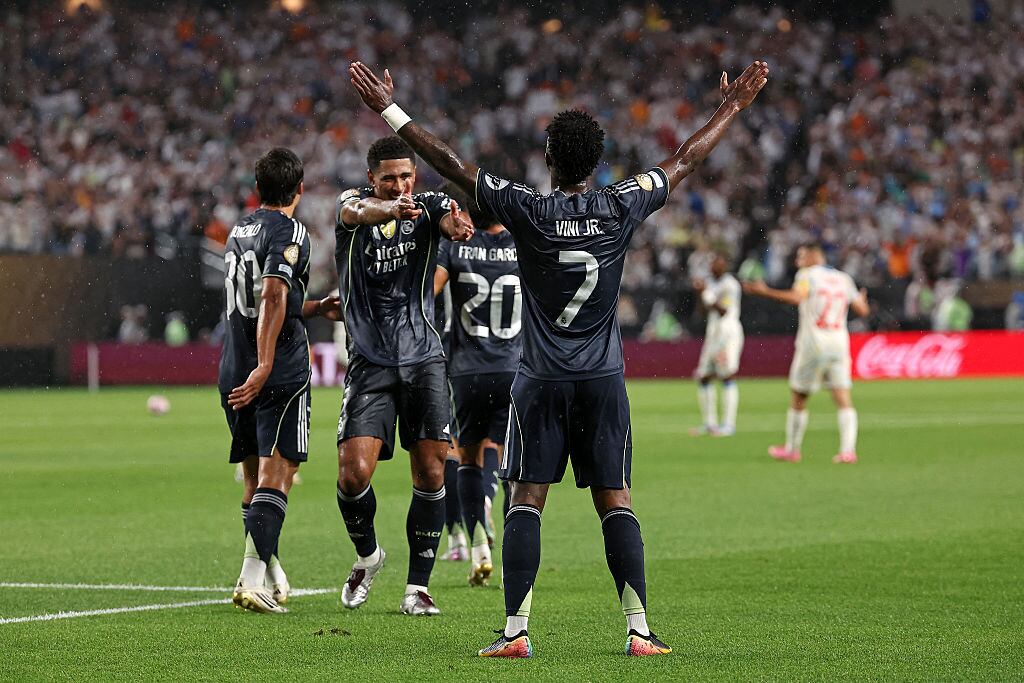 Real Madrid's Brazilian forward #07 Vinicius Junior celebrates scoring his team's first goal with Real Madrid's English midfielder #05 Jude Bellingham (C) during the FIFA Club World Cup 2025 Group H football match between Austria's FC Salzburg and Spain's Real Madrid at Lincoln Financial Field Stadium in Philadelphia on June 26, 2025. (Photo by FRANCK FIFE / AFP) (Photo by FRANCK FIFE/AFP via Getty Images)          