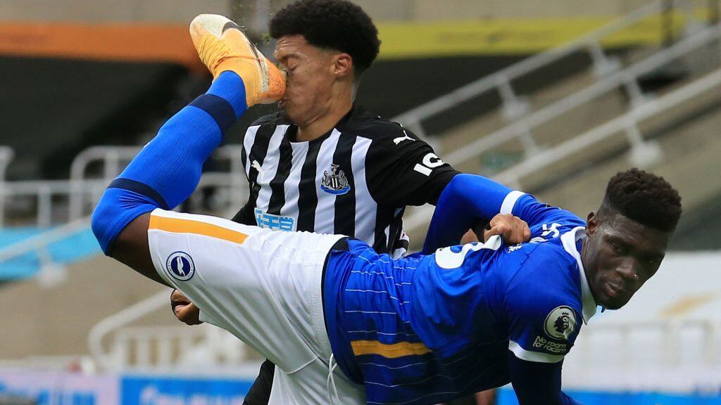 NEWCASTLE UPON TYNE, ENGLAND - SEPTEMBER 20: Jamal Lewis of Newcastle United is kicked in the face by Yves Bissouma of Brighton and Hove Albion, leading to a red card for Yves Bissouma of Brighton and Hove Albion during the Premier League match between Newcastle United and Brighton & Hove Albion at St. James Park on September 20, 2020 in Newcastle upon Tyne, England. (Photo by Lindsey Parnaby - Pool/Getty Images)