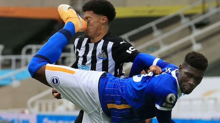 NEWCASTLE UPON TYNE, ENGLAND - SEPTEMBER 20: Jamal Lewis of Newcastle United is kicked in the face by Yves Bissouma of Brighton and Hove Albion, leading to a red card for Yves Bissouma of Brighton and Hove Albion during the Premier League match between Newcastle United and Brighton & Hove Albion at St. James Park on September 20, 2020 in Newcastle upon Tyne, England. (Photo by Lindsey Parnaby - Pool/Getty Images)