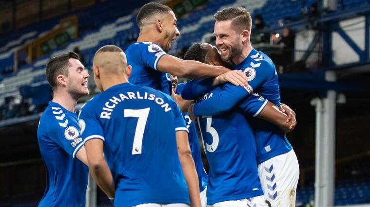 LIVERPOOL, ENGLAND - DECEMBER 19: Yerry Mina of Everton celebrates scoring his teams second goal with team mates during the Premier League match between Everton and Arsenal at Goodison Park on December 19, 2020 in Liverpool, England. A limited number of fans (2000) are welcomed back to stadiums to watch elite football across England. This was following easing of restrictions on spectators in tiers one and two areas only. (Photo by Emma Simpson - Everton FC/Everton FC via Getty Images)