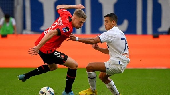 Rennes' French defender Adrien Truffert (L) fights for the ball with Marseille's Chilean forward Alexis Sanchez (R) during the French L1 football match between Olympique Marseille (OM) and Stade Rennais FC (Rennes) at Stade Velodrome in Marseille, southern France on September 18, 2022. (Photo by Nicolas TUCAT / AFP) (Photo by NICOLAS TUCAT/AFP via Getty Images)